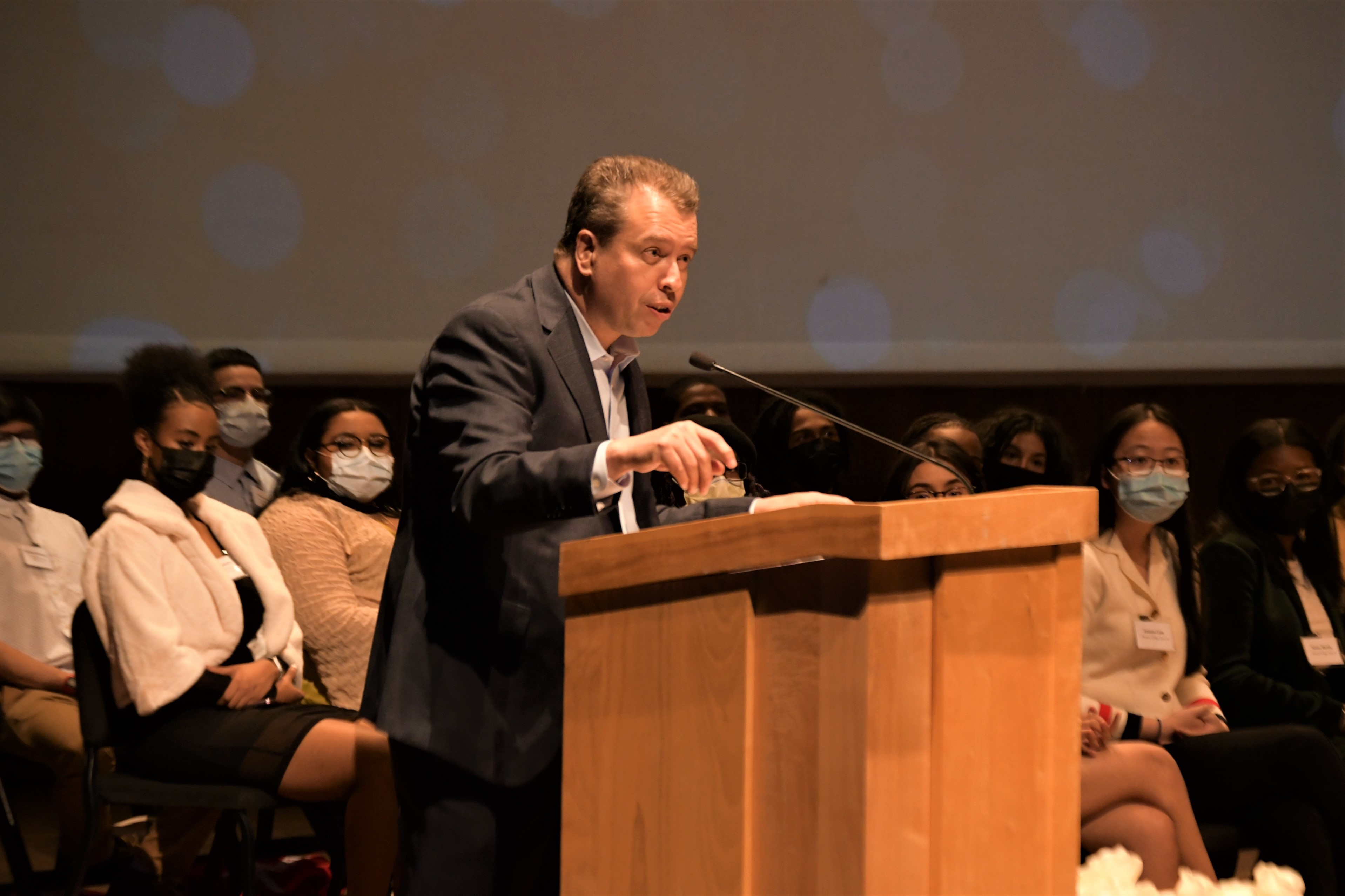 man speaking at a podium.